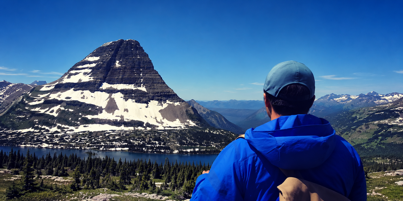 Zhenxuan Wang overlooking a snow-capped mountain
